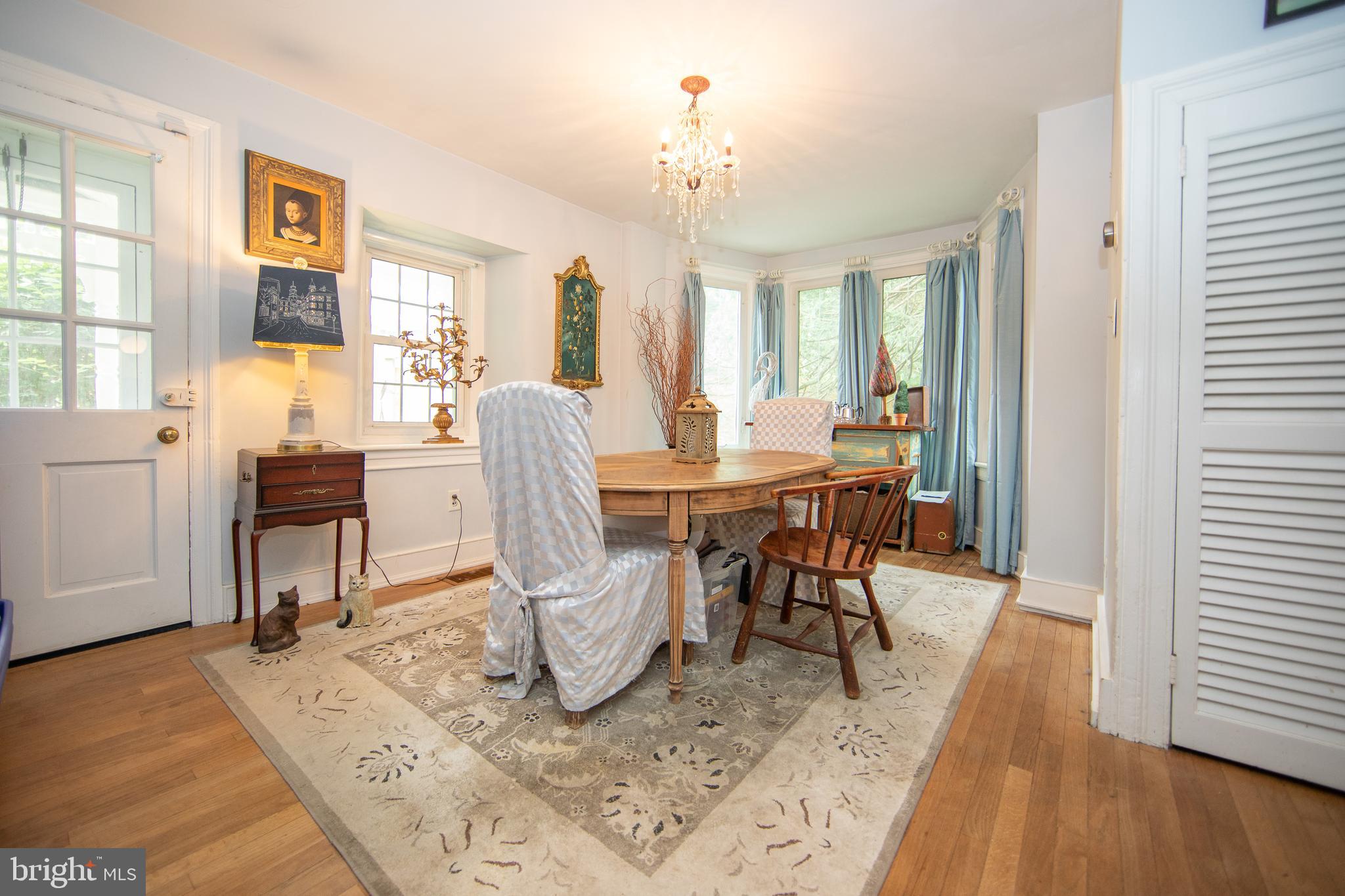 4 Seminary Road Glenmoore, PA 19343 - Photo 8 of 35 a dining room with wooden floor and large windows