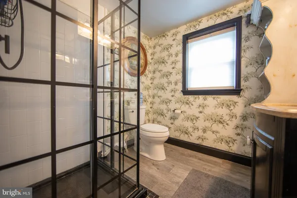 a bathroom with a bathtub and shower