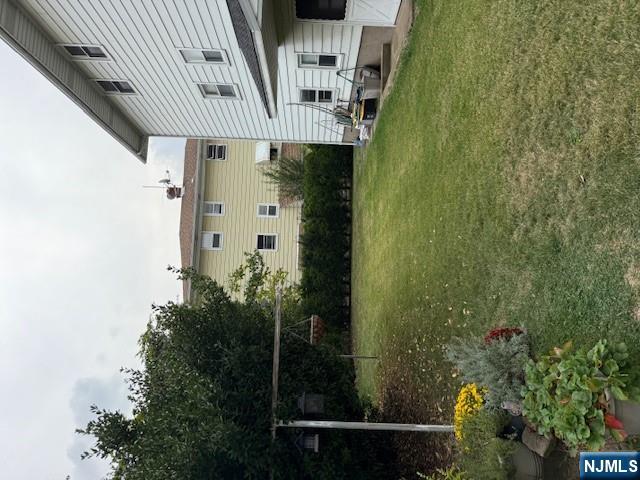 911 York Street, Unit 2 East Rutherford, NJ 07073 - Photo 11 of 12 a view of a patio with table and chairs and potted plants