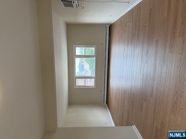 911 York Street, Unit 2 East Rutherford, NJ 07073 - Photo 2 of 12 a view of empty room with window and wooden floor