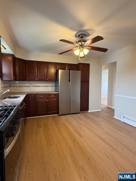 911 York Street, Unit 2 East Rutherford, NJ 07073 - Photo 6 of 12 a kitchen with stainless steel appliances granite countertop a stove cabinets and refrigerator