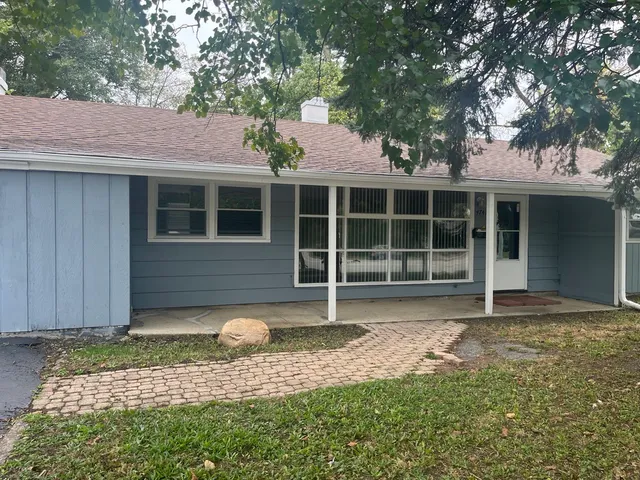a house with trees in the background