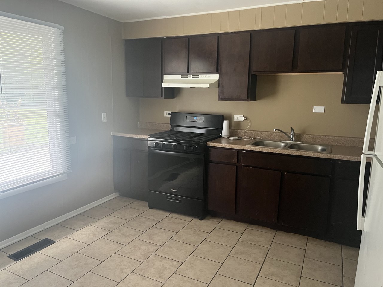 4741 183rd Street Country Club Hills, IL 60478 - Photo 11 of 18 a kitchen with a sink and a stove