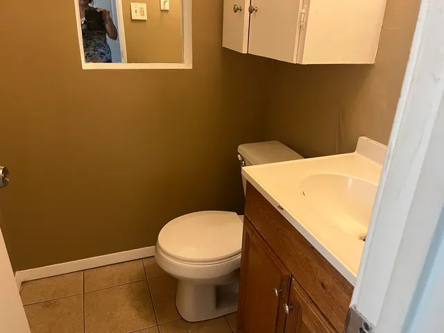 a bathroom with a toilet and a sink