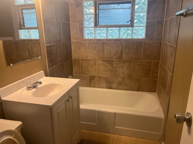 a bathroom with a sink and a bathtub