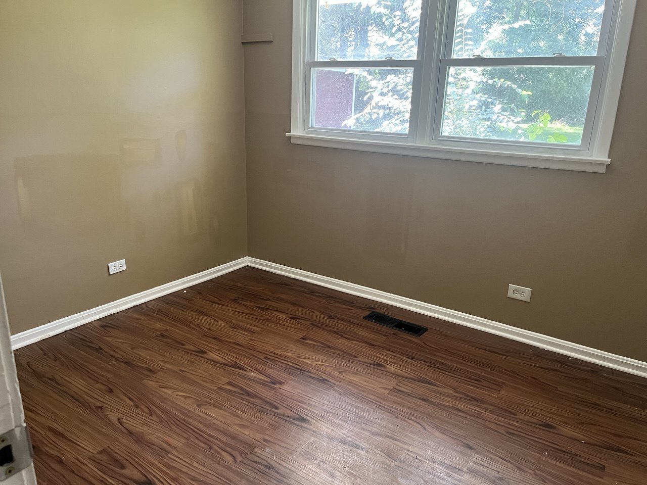 4741 183rd Street Country Club Hills, IL 60478 - Photo 6 of 18 an empty room with wooden floor and windows