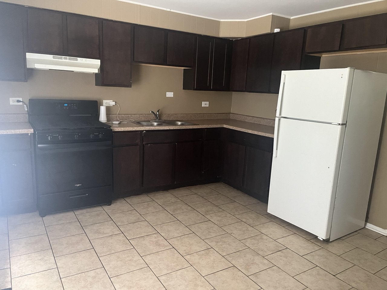 4741 183rd Street Country Club Hills, IL 60478 - Photo 10 of 18 a kitchen with a refrigerator and cabinets