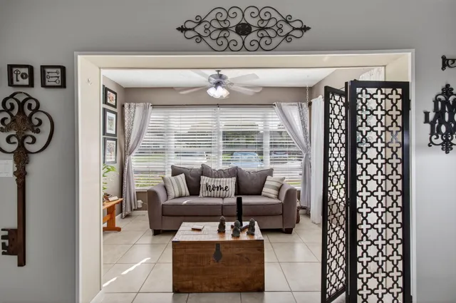a living room with furniture and a large window