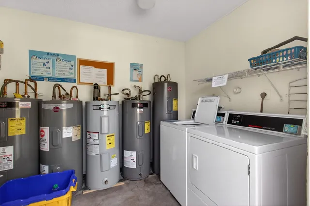 a room with refrigerator and washer