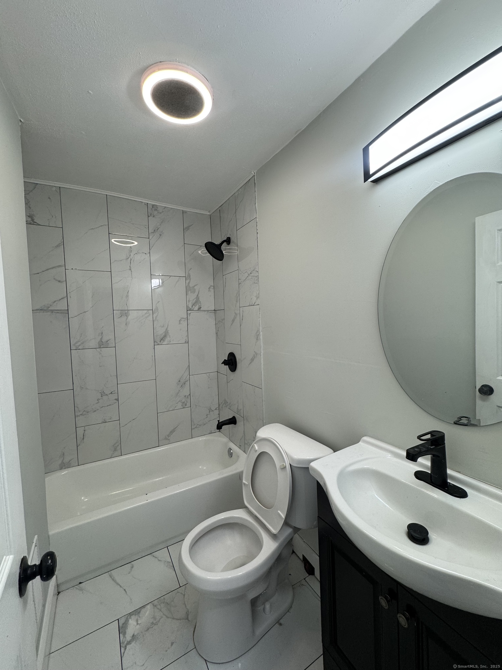 648 Ferry Street, Unit 3 New Haven, CT 06513 - Photo 4 of 9 a bathroom with a sink toilet and shower