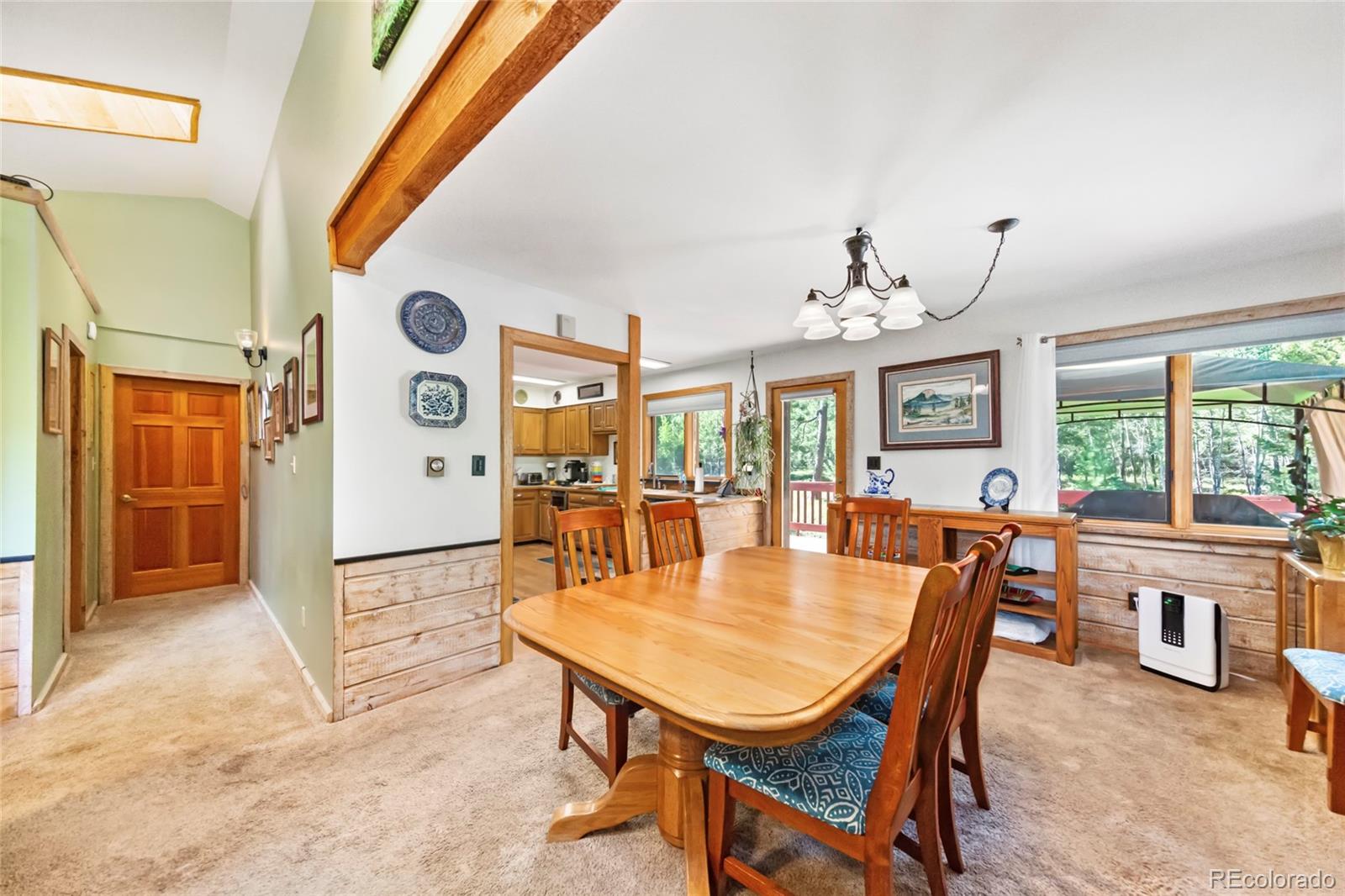 444 Nova Road Pine, CO 80470 - Photo 15 of 40 a dining room with furniture and window