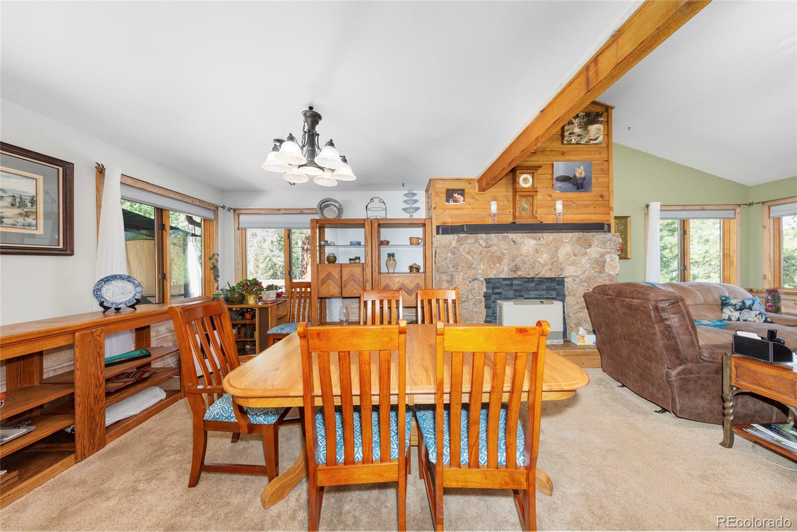 444 Nova Road Pine, CO 80470 - Photo 17 of 40 a balcony with furniture and a fireplace