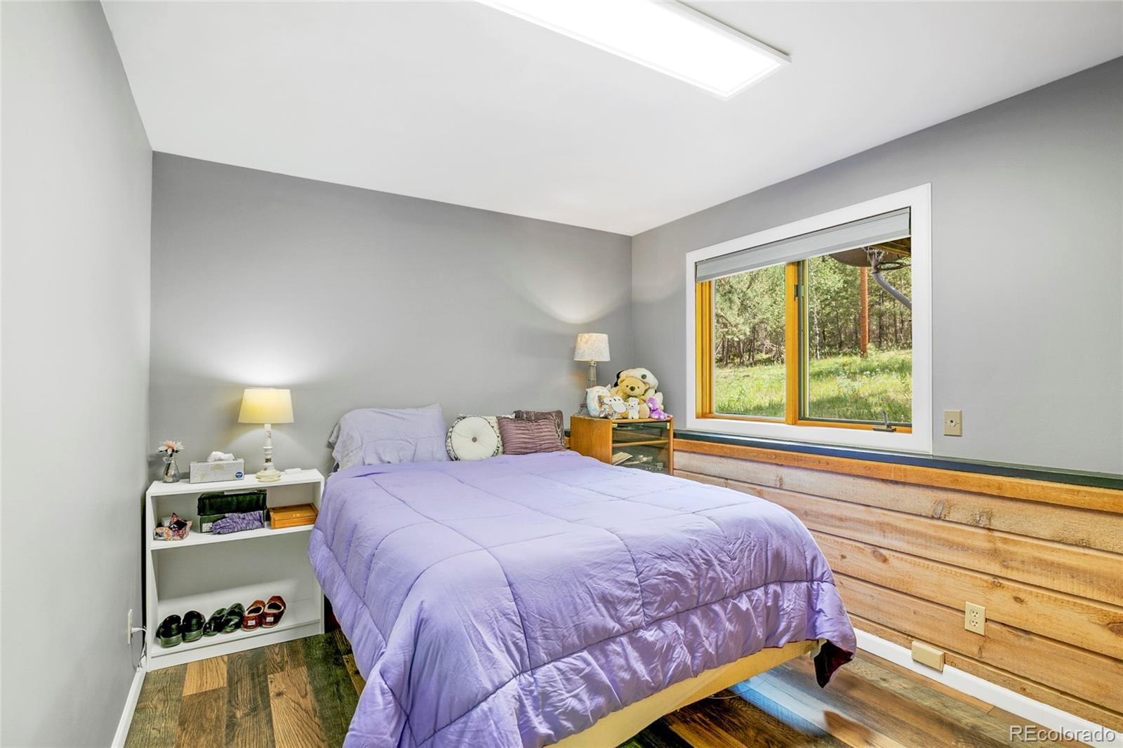 444 Nova Road Pine, CO 80470 - Photo 27 of 40 a bedroom with a bed and a window