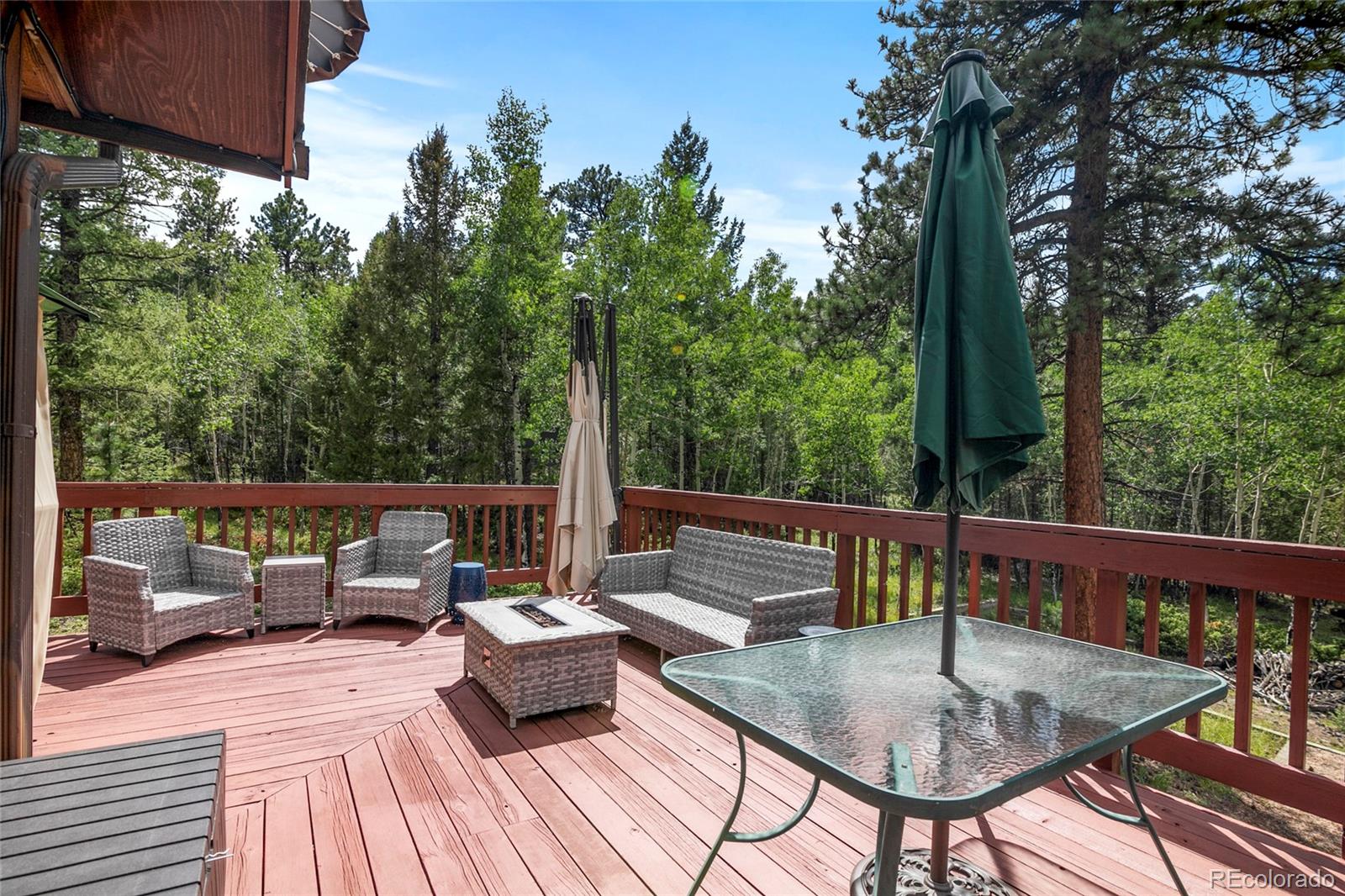444 Nova Road Pine, CO 80470 - Photo 29 of 40 a view of balcony with couch and outdoor seating