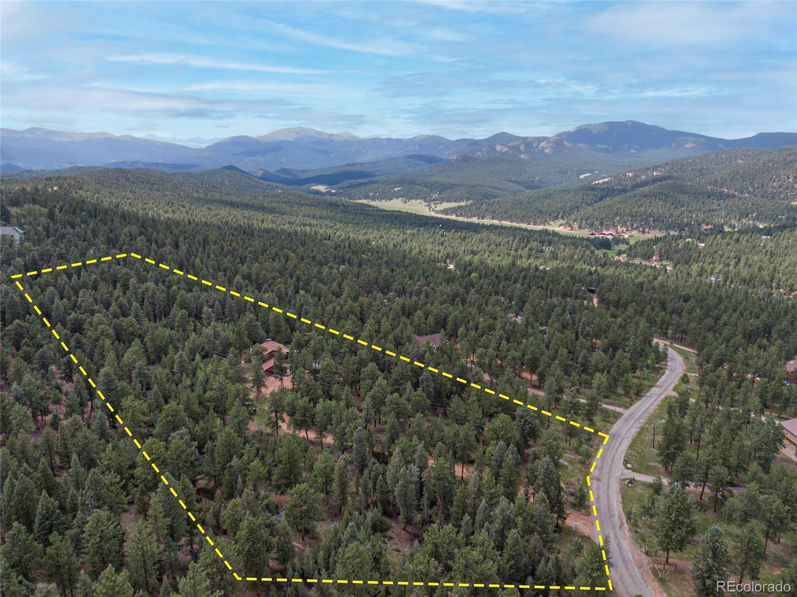 444 Nova Road Pine, CO 80470 - Photo 5 of 40 a view of a city with mountains in the background