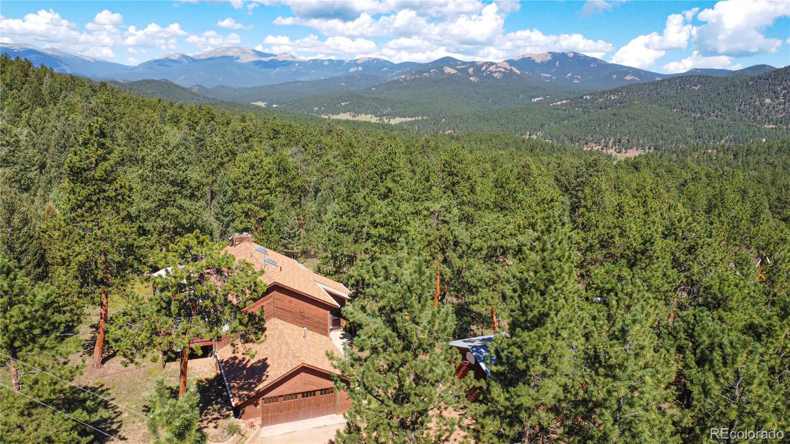 444 Nova Road Pine, CO 80470 - Photo 6 of 40 a view of a field with mountains in the background