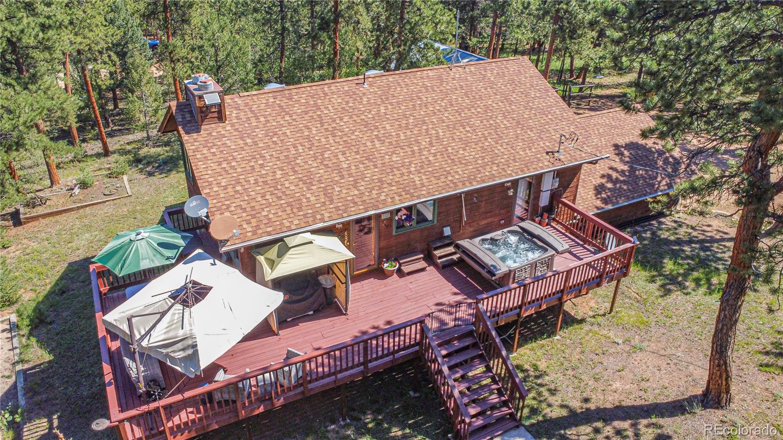 444 Nova Road Pine, CO 80470 - Photo 7 of 40 an aerial view of a house with a yard and balcony