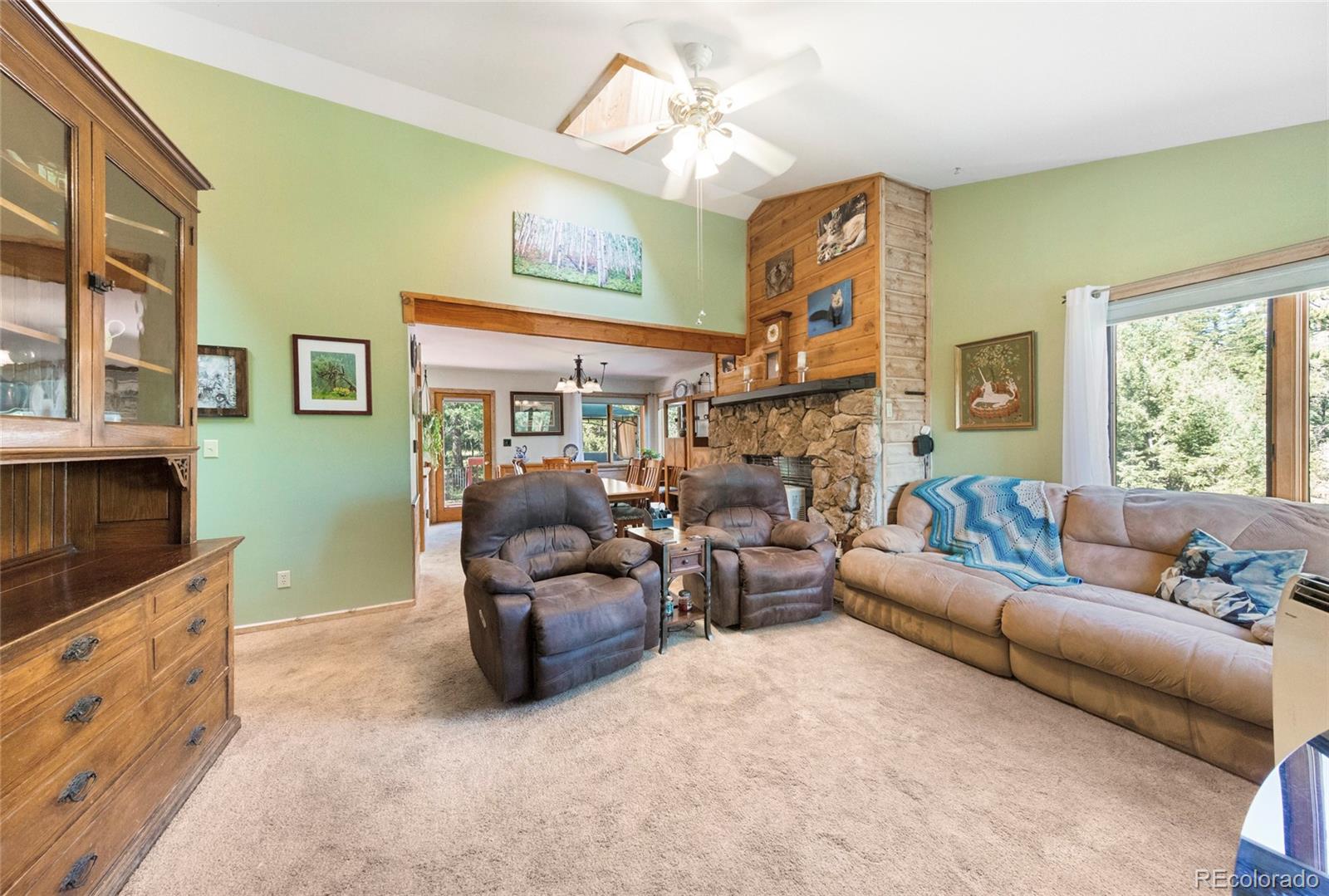 444 Nova Road Pine, CO 80470 - Photo 9 of 40 a living room with fireplace furniture and a window