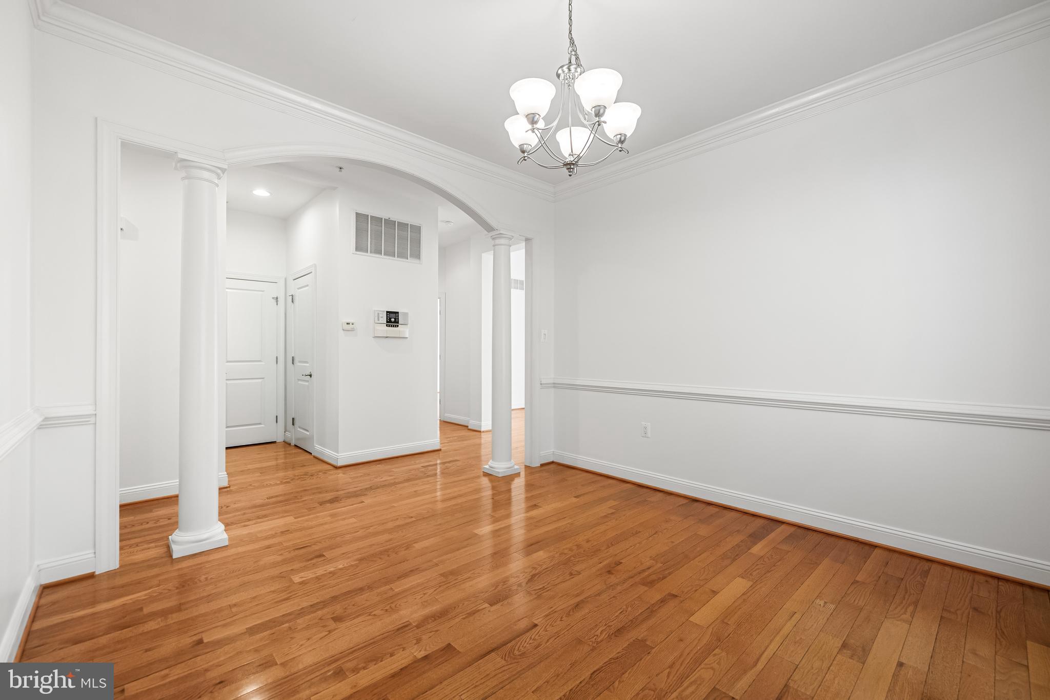 6716 Newstead Lane Baltimore, MD 21209 - Photo 12 of 66 a view of a livingroom with wooden floor