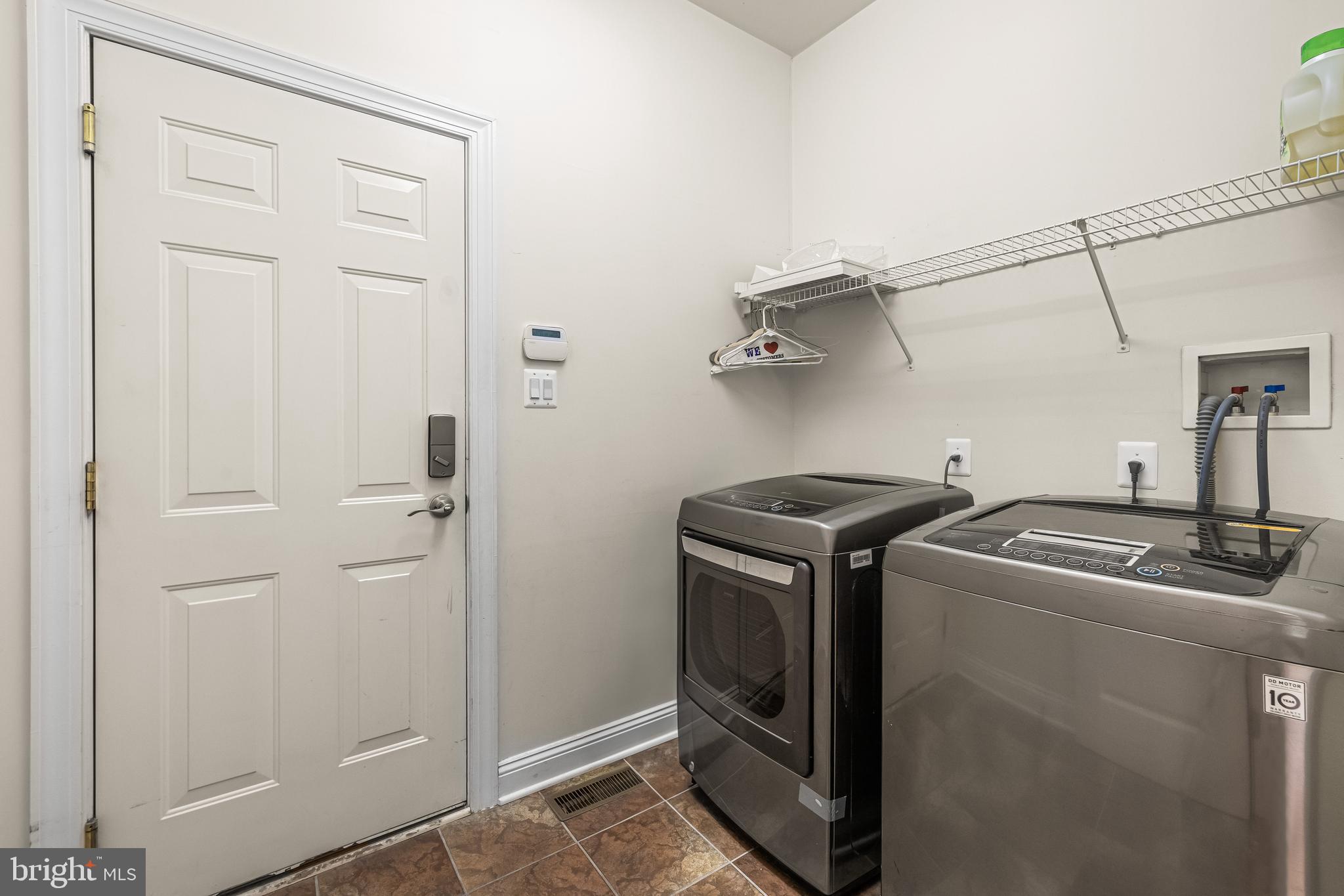 6716 Newstead Lane Baltimore, MD 21209 - Photo 15 of 66 a utility room with dryer and washer