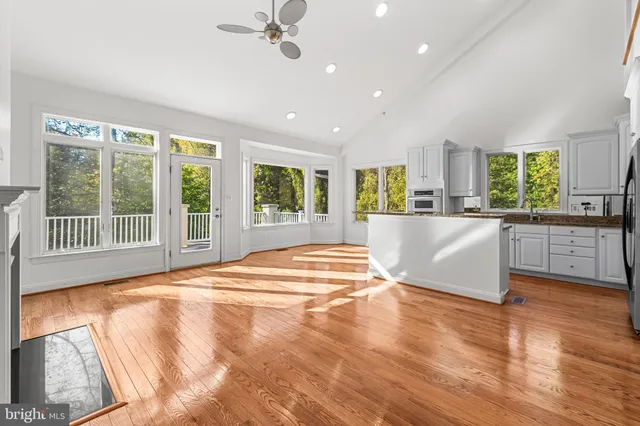 a view of an empty room with a window and balcony view