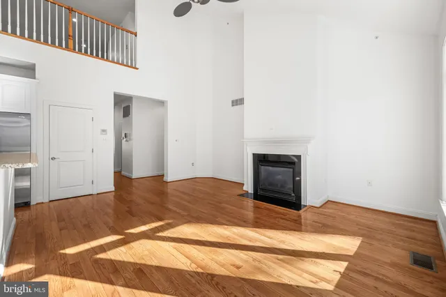 a kitchen with stainless steel appliances granite countertop a stove and a refrigerator