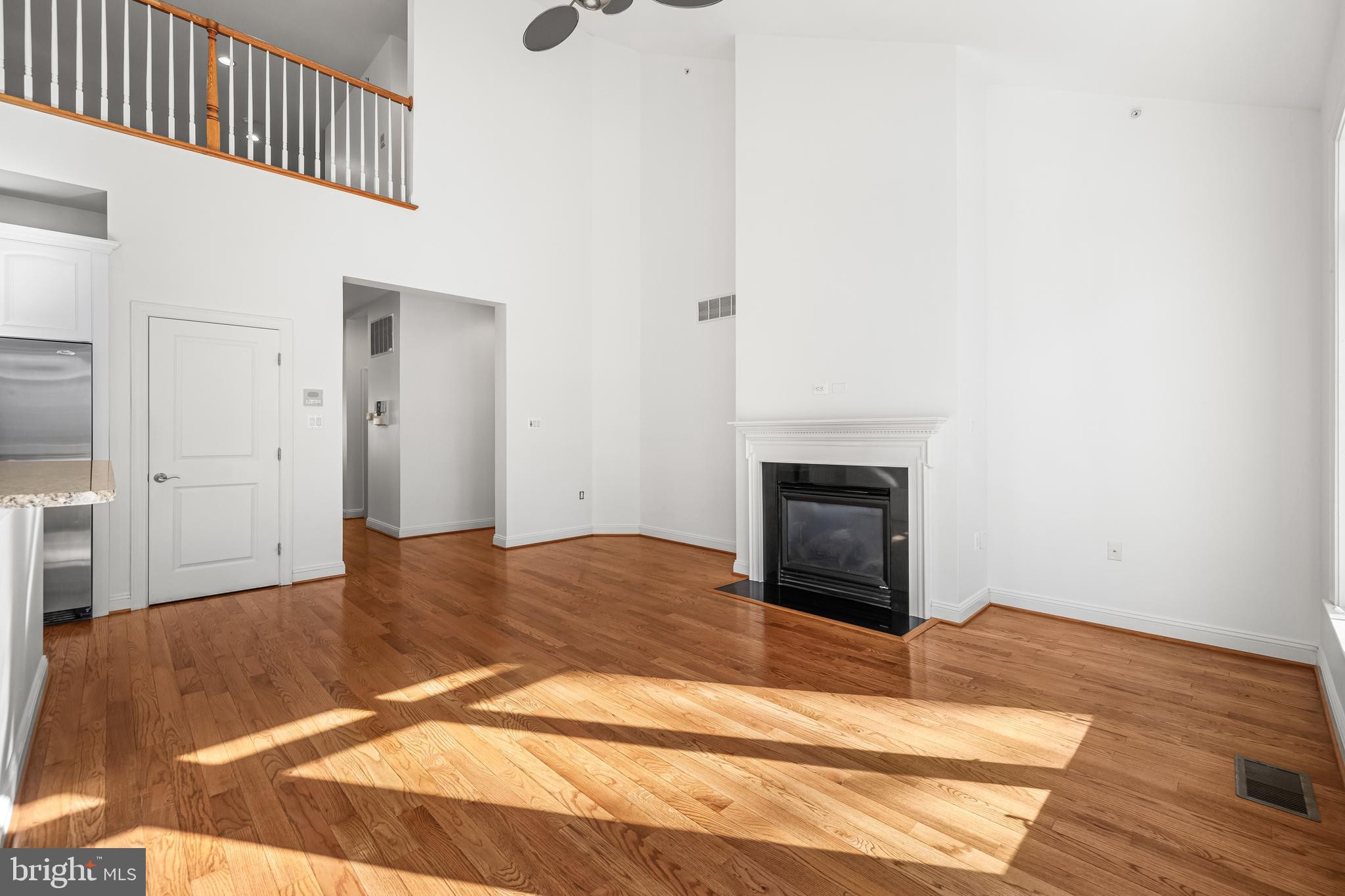 6716 Newstead Lane Baltimore, MD 21209 - Photo 20 of 66 a bedroom with a bed and a fireplace