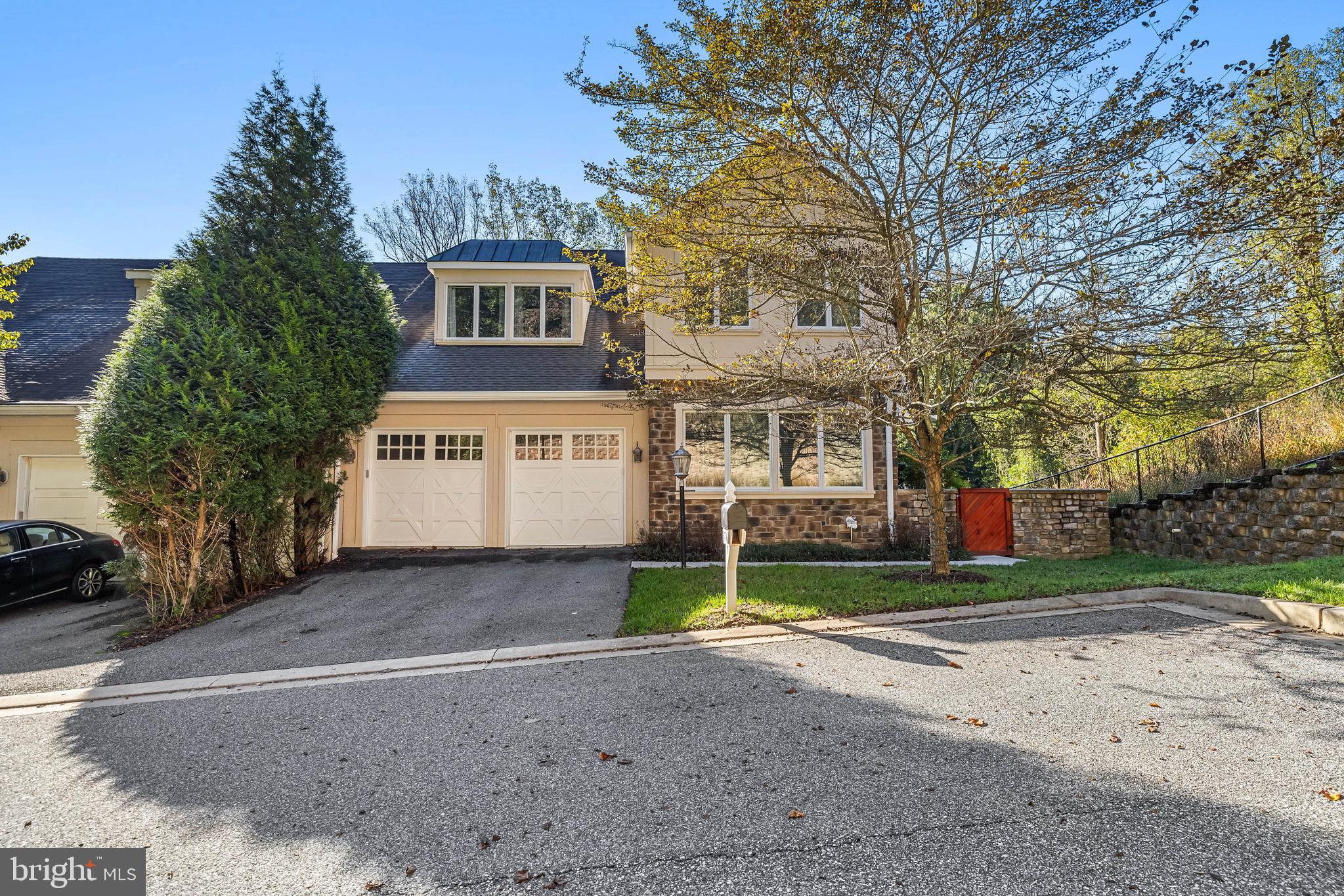 6716 Newstead Lane Baltimore, MD 21209 - Photo 2 of 66 a front view of a house with a yard and garage
