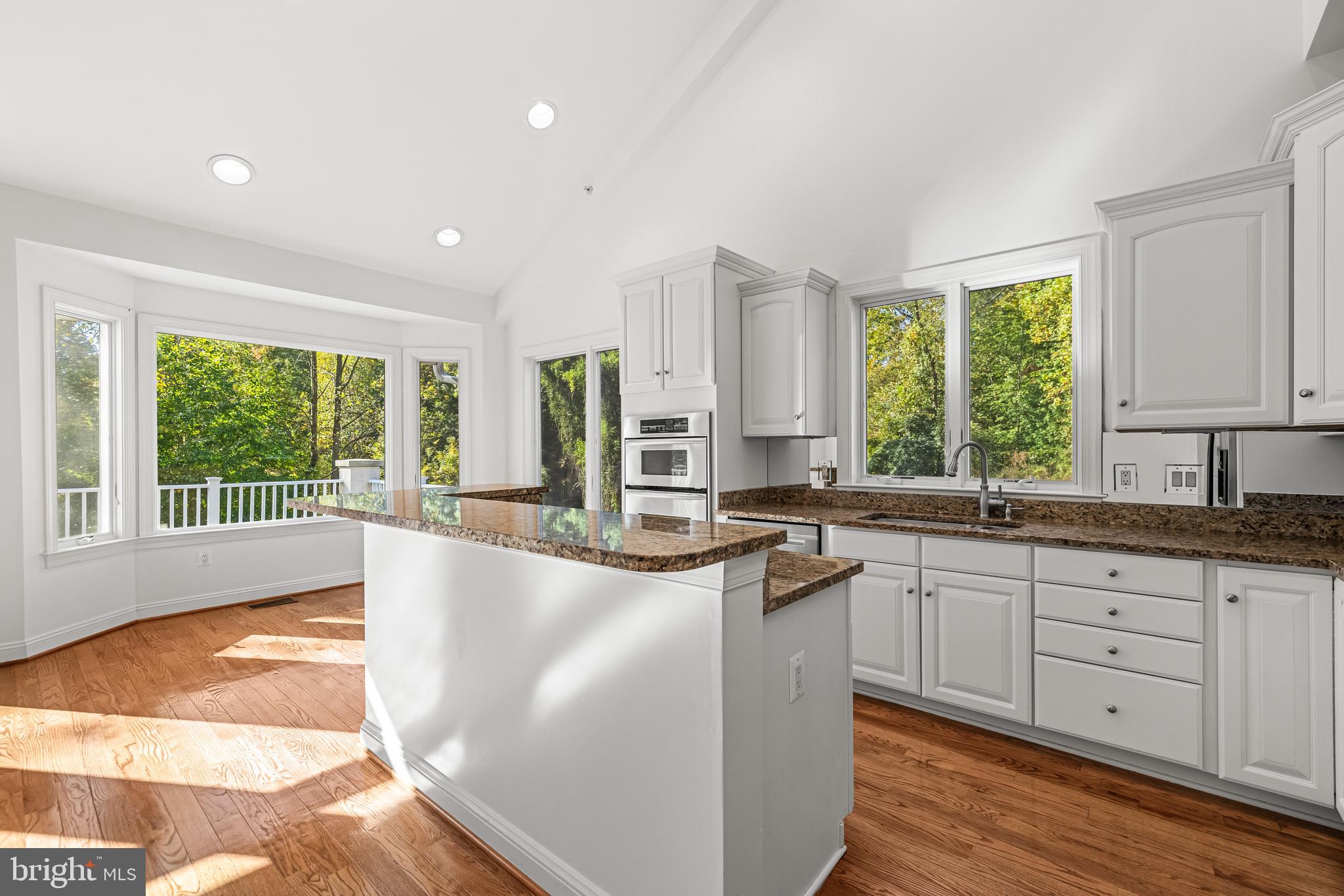 6716 Newstead Lane Baltimore, MD 21209 - Photo 25 of 66 a large kitchen with kitchen island granite countertop a large window