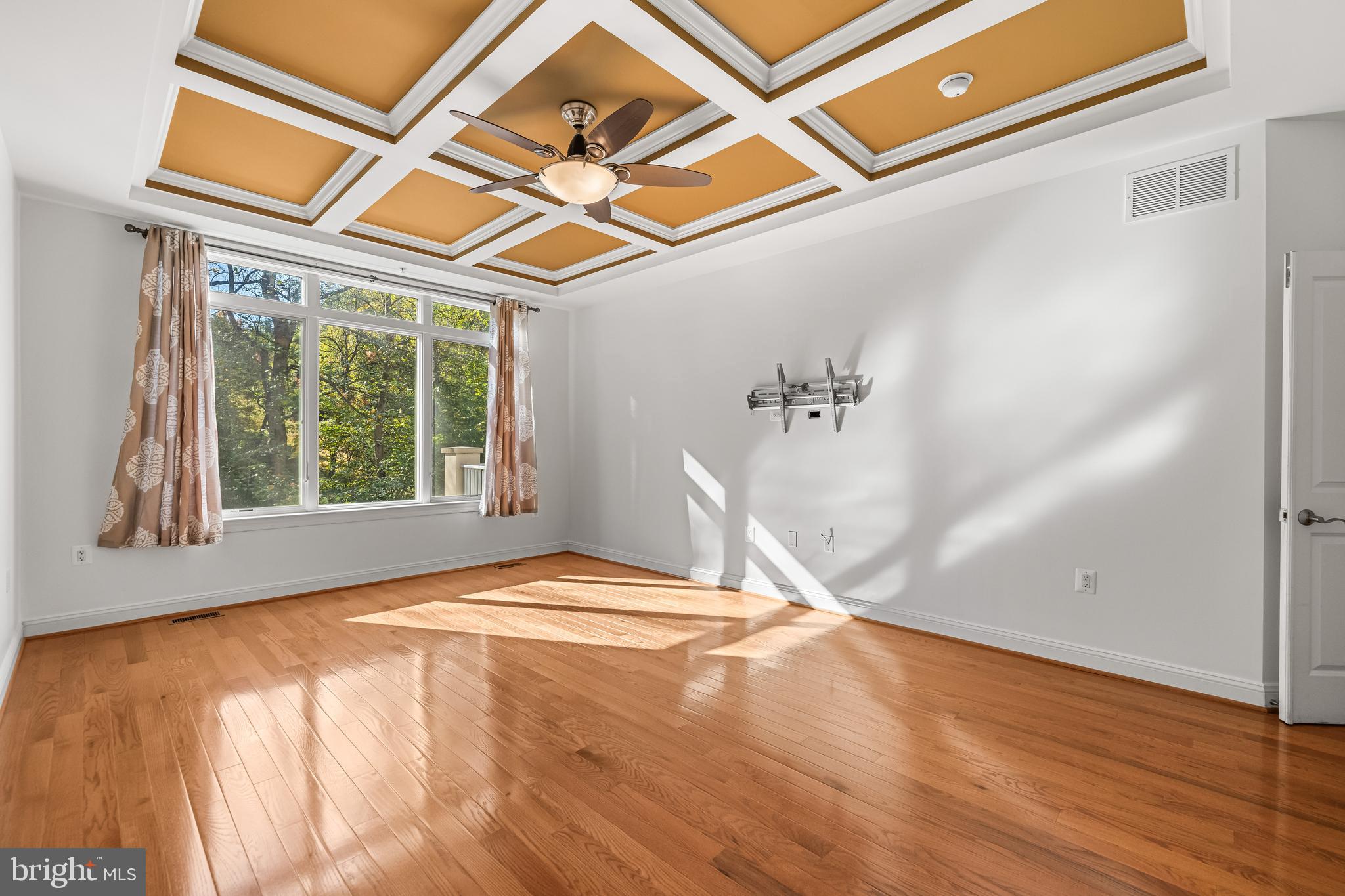 6716 Newstead Lane Baltimore, MD 21209 - Photo 33 of 66 a view of a room with wooden floor and windows