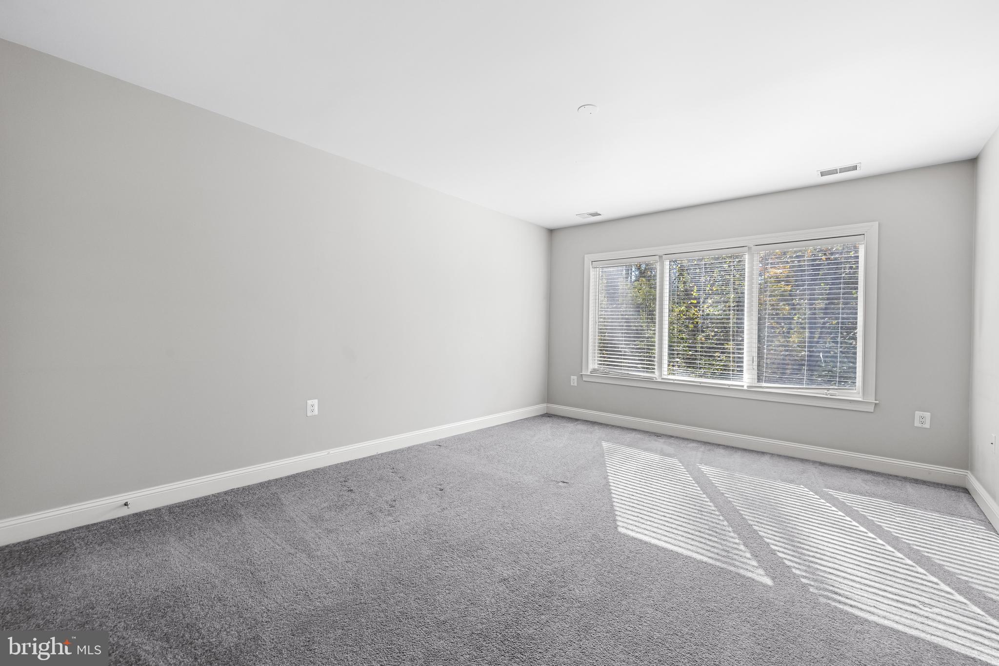 6716 Newstead Lane Baltimore, MD 21209 - Photo 48 of 66 an empty room with a window