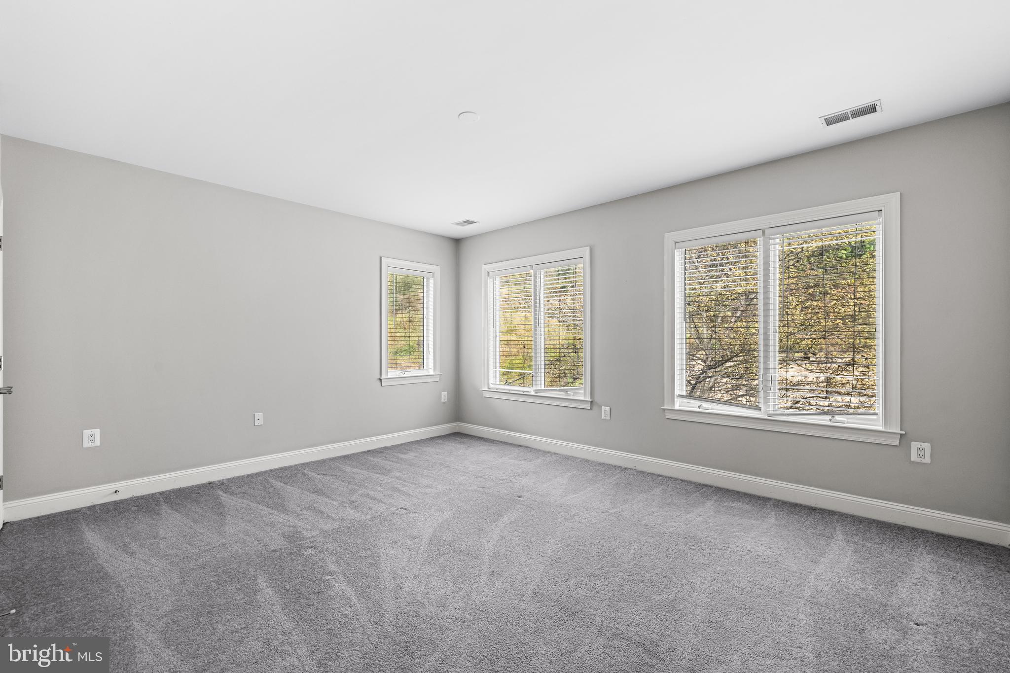 6716 Newstead Lane Baltimore, MD 21209 - Photo 51 of 66 a view of an empty room with a window