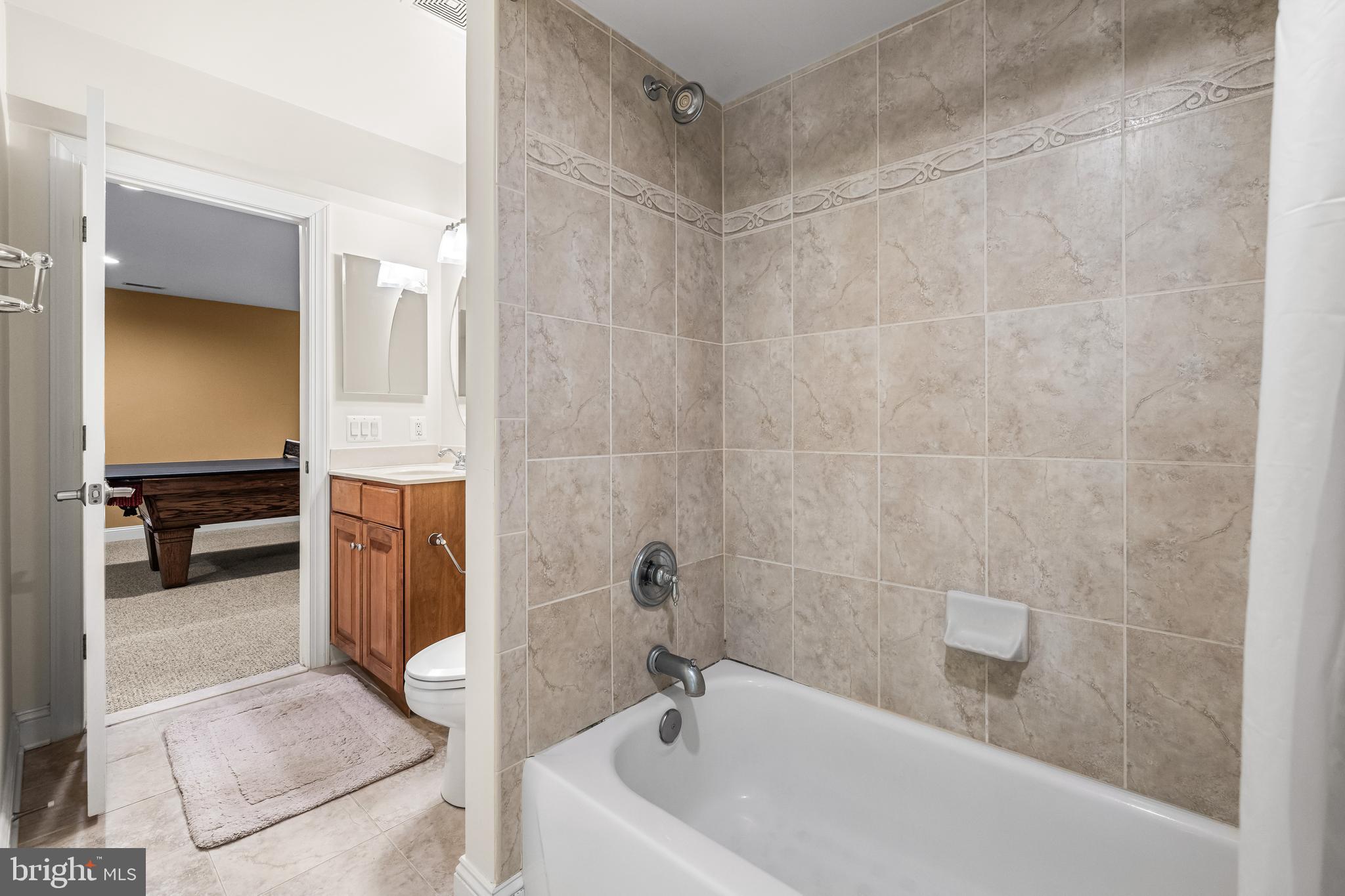 6716 Newstead Lane Baltimore, MD 21209 - Photo 61 of 66 a bathroom with a tub and a shower