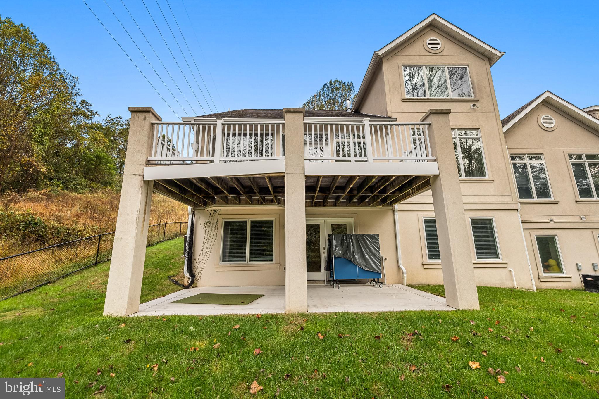 6716 Newstead Lane Baltimore, MD 21209 - Photo 63 of 66 a front view of a house with a yard and garage