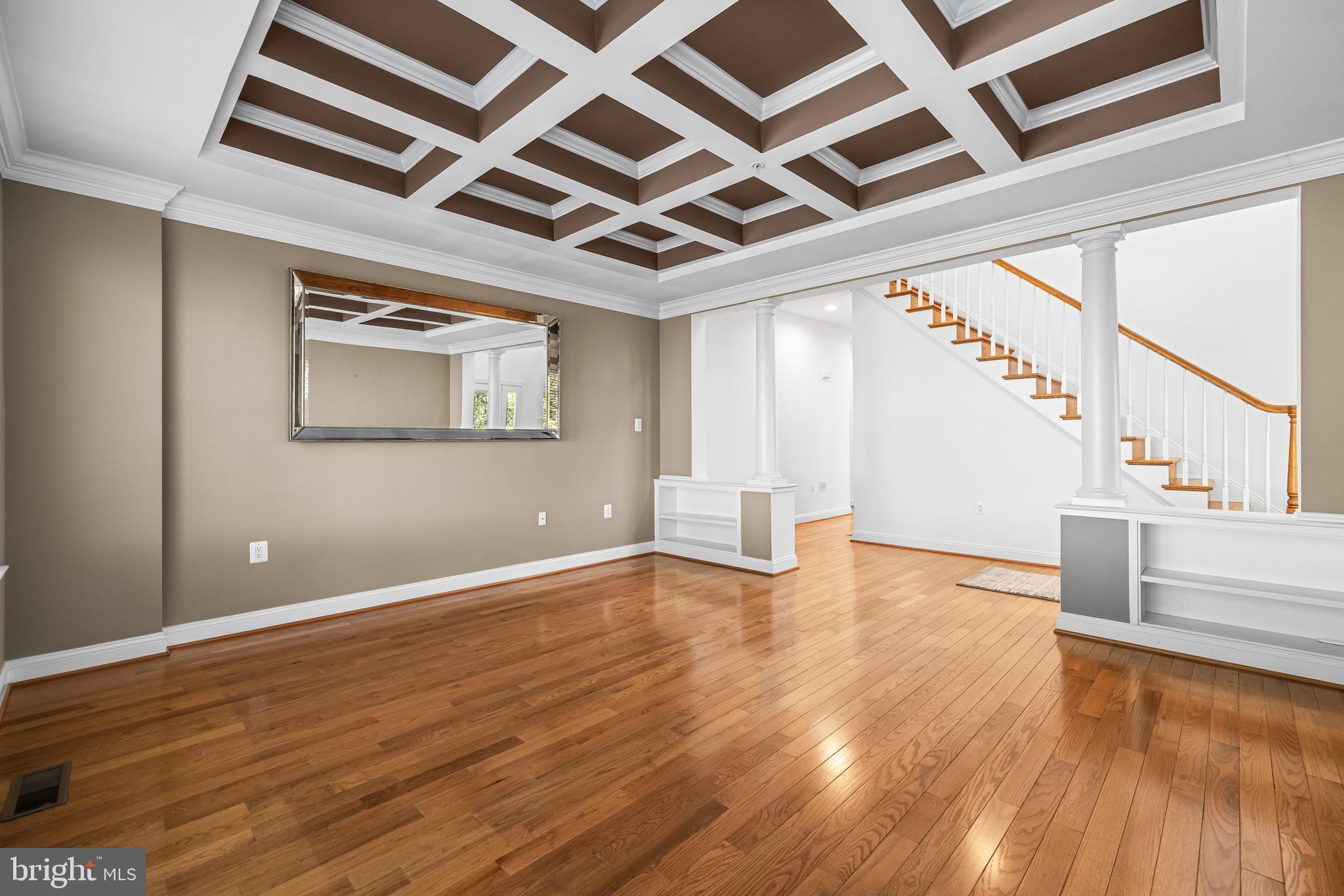 6716 Newstead Lane Baltimore, MD 21209 - Photo 10 of 66 an empty room with wooden floor and windows