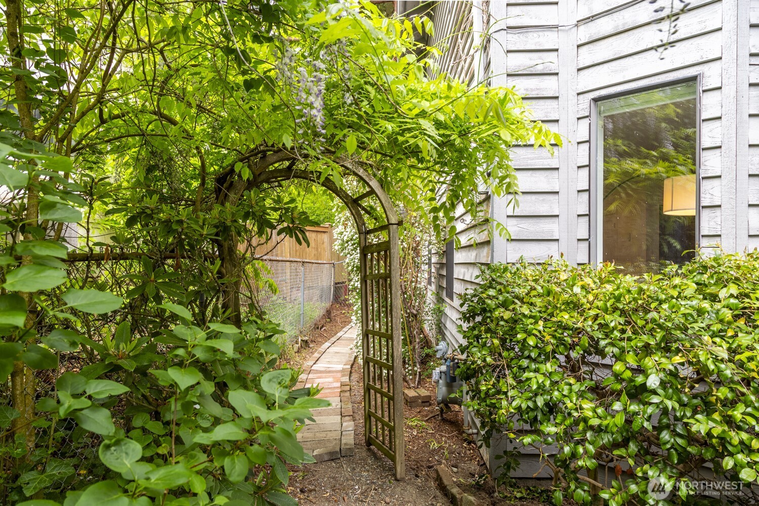 912 Northeast 115th Street Seattle, WA 98125 - Photo 20 of 21 a view of a garden with plants