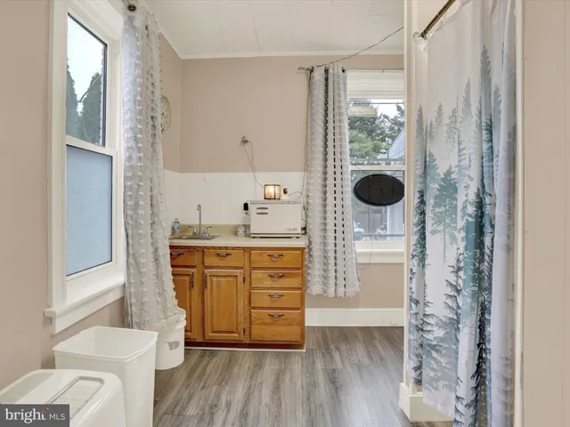 a view of workspace with furniture and a window