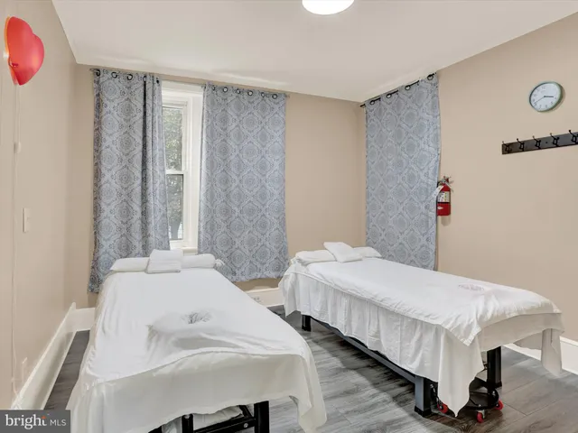 a bedroom with a bed and cabinets