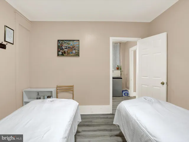 a bedroom with a bed and a desk