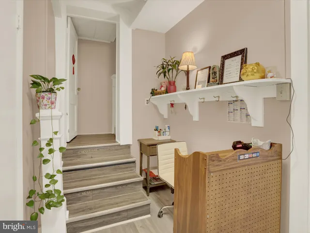 a workspace with furniture and wooden floor