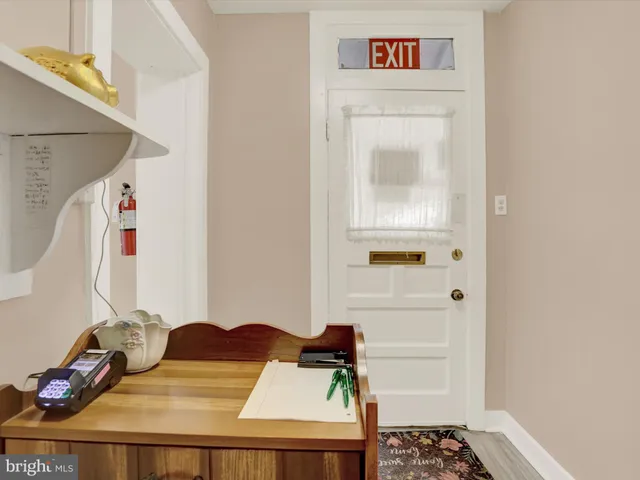 a view of a bedroom with a bed and toys