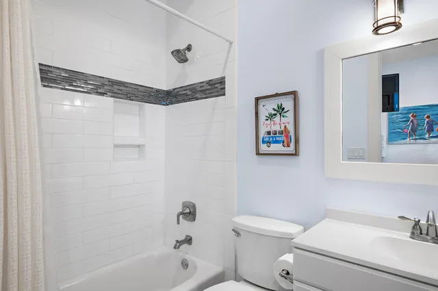 a bedroom with a bed and a television