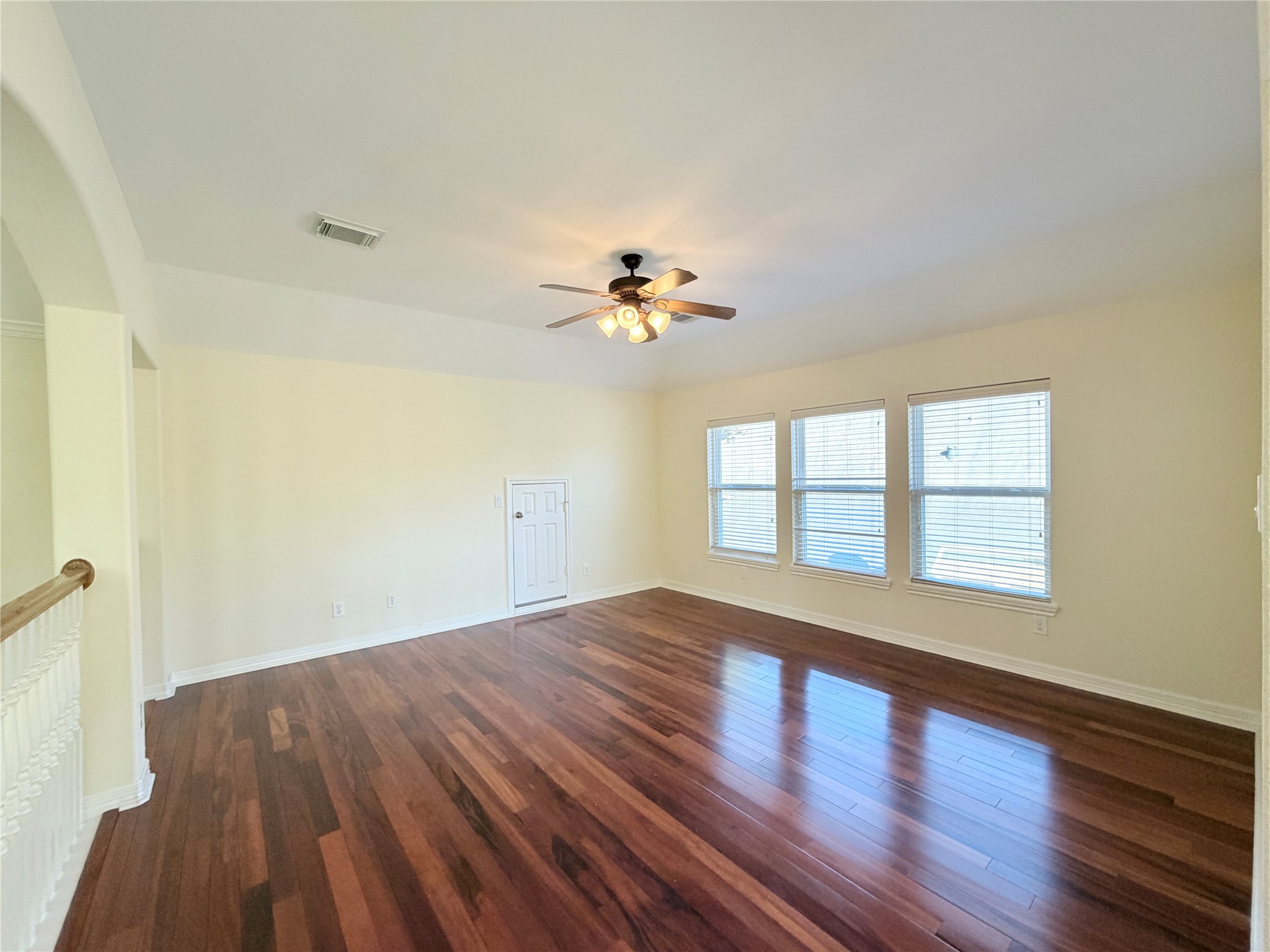 28015 Silverstream Court Fulshear, TX 77441 - Photo 22 of 33 wooden floor in an empty room with a window