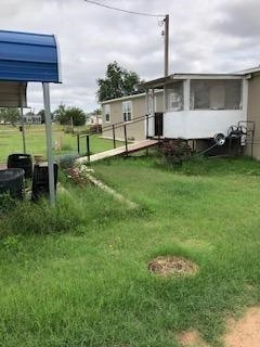 415 Jasper Street Post, TX 79356 - Photo 3 of 16 Back yard and carport