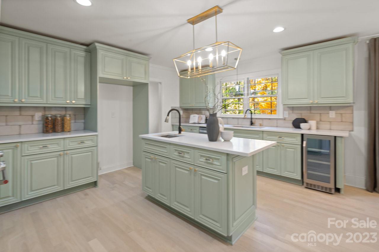 4215 Kuykendall Road Charlotte, NC 28270 - Photo 13 of 43 a kitchen with kitchen island granite countertop a sink cabinets and window