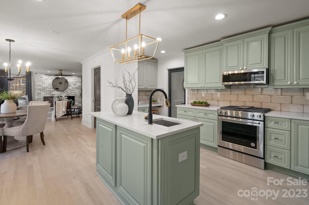 4215 Kuykendall Road Charlotte, NC 28270 - Photo 14 of 43 a kitchen with a sink stove and microwave