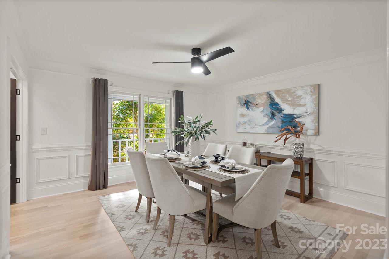 4215 Kuykendall Road Charlotte, NC 28270 - Photo 18 of 43 a dining room with furniture a rug and a floor to ceiling window