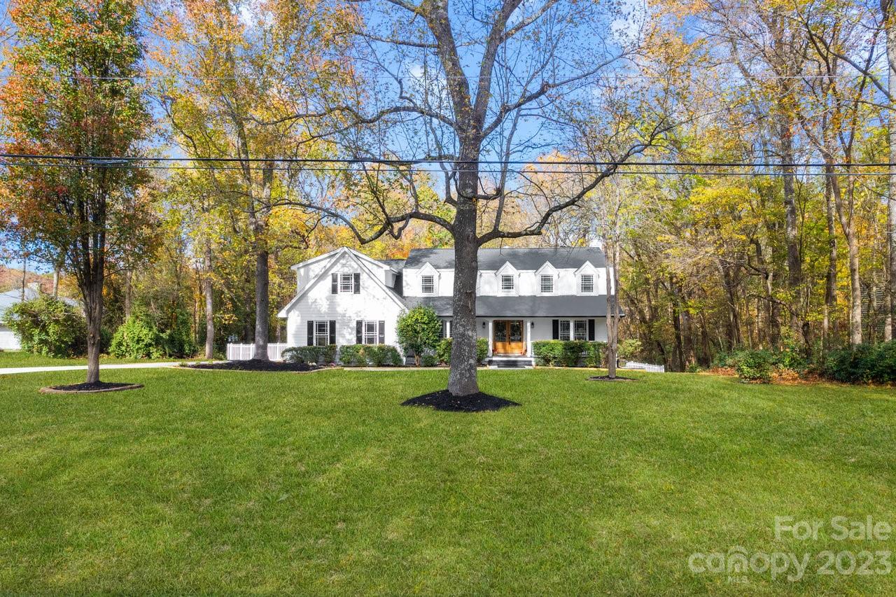 4215 Kuykendall Road Charlotte, NC 28270 - Photo 2 of 43 a house with a big yard and large trees