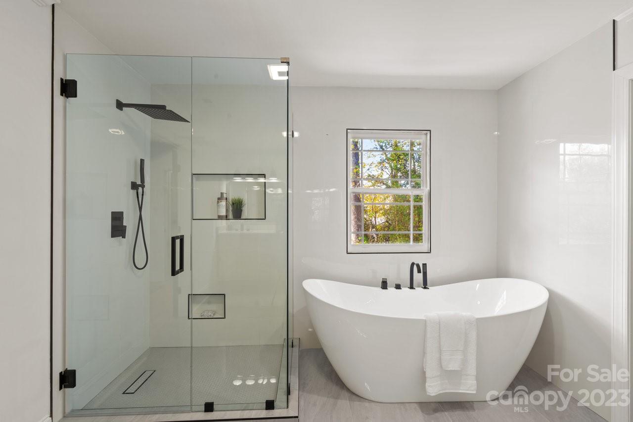 4215 Kuykendall Road Charlotte, NC 28270 - Photo 30 of 43 a bathroom with a bathtub and shower
