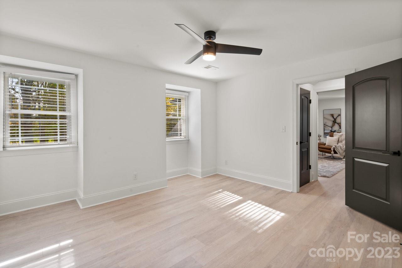 4215 Kuykendall Road Charlotte, NC 28270 - Photo 31 of 43 a view of livingroom with hardwood floor and a ceiling fan